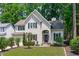 Charming two-story home with well-maintained lawn, classic architectural details, and a welcoming front entrance at 208 Silk Hope Dr, Cary, NC 27519