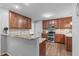 Efficient kitchen with granite countertops, stainless steel appliances, and ample cabinet space ensures convenient meal preparation at 208 Silk Hope Dr, Cary, NC 27519