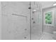 Luxurious shower featuring a rainfall showerhead, and integrated shelving at 208 Silk Hope Dr, Cary, NC 27519
