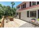 Spacious wooden deck with comfortable seating and a fire pit, ideal for outdoor enjoyment at 210 Peachtree St, Roxboro, NC 27573