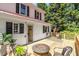 Inviting deck with a fire pit and seating, perfect for relaxing and entertaining outdoors at 210 Peachtree St, Roxboro, NC 27573