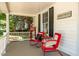 Inviting front porch with rocking chairs and decorative accents, creating a welcoming outdoor space at 210 Peachtree St, Roxboro, NC 27573