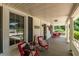 Covered front porch with comfortable seating, perfect for enjoying quiet moments and neighborhood views at 210 Peachtree St, Roxboro, NC 27573