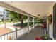 Inviting front porch with classic white columns and ample space for outdoor seating and decor at 210 Peachtree St, Roxboro, NC 27573