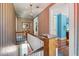 Striking hallway with vintage wallpaper details and natural lighting fixture at 210 Peachtree St, Roxboro, NC 27573