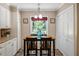 Bright breakfast nook area with natural lighting and modern tile flooring at 210 Peachtree St, Roxboro, NC 27573