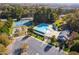 Aerial view of community pool, tennis courts, playground and parking at 2106 White Pond Ct, Apex, NC 27523