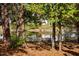 Backyard with a bench and pond view at 2106 White Pond Ct, Apex, NC 27523