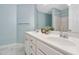 Bathroom featuring double sinks with white vanity, marble floors, and a large mirror at 2106 White Pond Ct, Apex, NC 27523