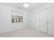 Bright bedroom features a large window and double door closet at 2106 White Pond Ct, Apex, NC 27523
