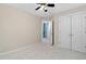 Bedroom featuring a ceiling fan, open door, and closet at 2106 White Pond Ct, Apex, NC 27523