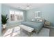Serene bedroom with a queen bed, light blue walls, and a bright window at 2106 White Pond Ct, Apex, NC 27523