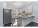 Bright kitchen features granite countertops, stainless appliances, and a large window at 2106 White Pond Ct, Apex, NC 27523
