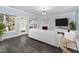 Inviting living room with a fireplace, modern decor, and large windows for ample light at 2106 White Pond Ct, Apex, NC 27523