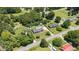 Birds eye view of a home with its large tree-lined lot featuring a long drive at 2119 Northcrest Dr, Elon, NC 27244