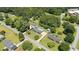 Birds eye view of a home with its large tree-lined lot featuring a long drive at 2119 Northcrest Dr, Elon, NC 27244