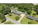 Aerial view of a home with a large tree-lined lot featuring a long drive at 2119 Northcrest Dr, Elon, NC 27244