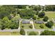 Aerial view of the property with mature trees, showcasing its location and surrounding landscape at 2119 Northcrest Dr, Elon, NC 27244