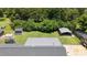 Expansive backyard featuring a large shed and covered shelter, surrounded by mature trees offering lots of privacy at 2119 Northcrest Dr, Elon, NC 27244