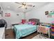 Charming bedroom featuring hardwood floors, ceiling fan, and a built-in closet at 2119 Northcrest Dr, Elon, NC 27244