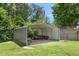 Open carport with a sturdy metal roof, providing ample space for parking and equipment storage at 2119 Northcrest Dr, Elon, NC 27244