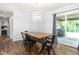 Dining room featuring a wooden table and chairs with a sliding glass door at 2119 Northcrest Dr, Elon, NC 27244
