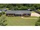 Charming single-story brick home with a well-manicured lawn and lush landscaping, offering a welcoming curb appeal at 2119 Northcrest Dr, Elon, NC 27244