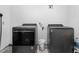 Efficient laundry room with modern, front-loading washer and dryer set for convenient laundry days at 2119 Northcrest Dr, Elon, NC 27244
