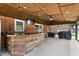 Outdoor patio featuring a built-in bar area and brick facade, ideal for outdoor dining and entertainment at 2119 Northcrest Dr, Elon, NC 27244