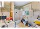 Bathroom with white tile, window, and tub/shower combo, offering a functional space needing some improvements at 218 Villa St, Rocky Mount, NC 27804