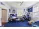 Bedroom with a ceiling fan, large windows at 218 Villa St, Rocky Mount, NC 27804