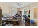 Cozy bedroom with hardwood floors, ceiling fan, and two windows providing natural light, needs TLC at 218 Villa St, Rocky Mount, NC 27804