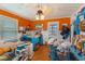 Bedroom with bright orange walls at 218 Villa St, Rocky Mount, NC 27804