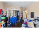 Bedroom featuring hardwood floors, bi-fold closet doors, and an ensuite bathroom offering convenience and functionality at 218 Villa St, Rocky Mount, NC 27804