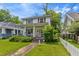 Charming two-story home featuring a welcoming front porch and landscaped yard at 218 Villa St, Rocky Mount, NC 27804