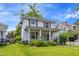 Charming two-story home featuring a welcoming front porch with classic columns at 218 Villa St, Rocky Mount, NC 27804