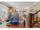 Inviting living room with brick accent wall, wood floors, and an open layout, perfect for entertaining guests at 218 Villa St, Rocky Mount, NC 27804