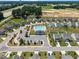 Aerial view of community pool, clubhouse and surrounding neighborhood at 22 Combine Trl, Benson, NC 27504