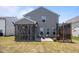 Cozy backyard with screened porch, seating area with fire pit, and hammock at 22 Combine Trl, Benson, NC 27504