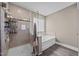 Bathroom showcasing a glass-enclosed shower, soaking tub and modern fixtures at 22 Combine Trl, Benson, NC 27504
