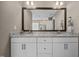 Bright bathroom with double vanity, granite countertop, and large mirror with modern fixtures at 22 Combine Trl, Benson, NC 27504