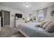 Bright bedroom with plush carpeting, ample natural light, and modern decor at 22 Combine Trl, Benson, NC 27504