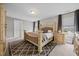 Bedroom featuring a large bed, carpet, two windows, and neutral decor at 22 Combine Trl, Benson, NC 27504