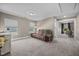 Spacious bonus room with plush carpeting, large windows, and neutral paint at 22 Combine Trl, Benson, NC 27504