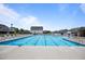 Large community pool with plenty of lounge chairs and a splash fountain at 22 Combine Trl, Benson, NC 27504