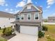 Charming two-story home featuring a two-car garage and manicured front yard at 22 Combine Trl, Benson, NC 27504