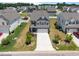 Charming two-story home featuring a spacious driveway and well-maintained landscaping at 22 Combine Trl, Benson, NC 27504