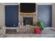 Elegant stone fireplace with a wooden mantel, ideal for gatherings in a cozy living space at 22 Combine Trl, Benson, NC 27504