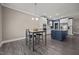 Stylish eat-in kitchen with a blue island, stainless appliances, and modern lighting at 22 Combine Trl, Benson, NC 27504