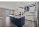 Open kitchen featuring white cabinets, granite counters, and stainless steel appliances at 22 Combine Trl, Benson, NC 27504